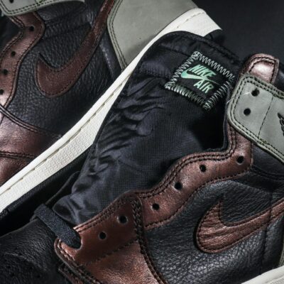 Detailed view of leather sneakers highlighting texture and design.