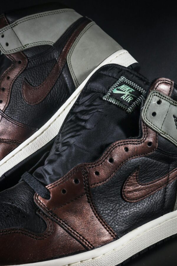 Detailed view of leather sneakers highlighting texture and design.